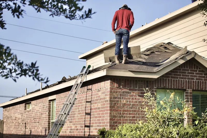Professional roofer working on a residential roof in Germantown